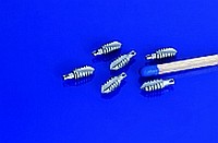 The demonstrator for a suture anchor made of iron-tricalcium phosphate (FE-TCP) is only slightly larger than a match head.